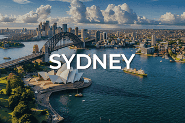 Aerial view of Sydney, highlighting the iconic Sydney Opera House and Harbour Bridge with the city skyline in the background. Perfectly situated for potential business for sale opportunities, the word 'SYDNEY' is prominently displayed over the image.